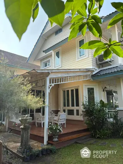 Charming suburban house with inviting porch and lush garden