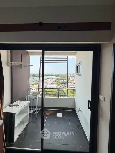 Spacious balcony with city view, perfect for relaxation and enjoying the outdoors.