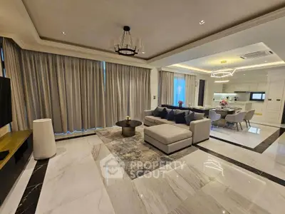 Luxurious open-plan living room with elegant decor and modern furnishings