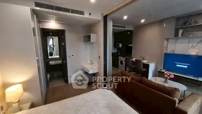 Modern open-plan studio with stylish living area and kitchen