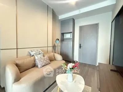 Modern living room with cozy sofa and stylish decor in a contemporary apartment.