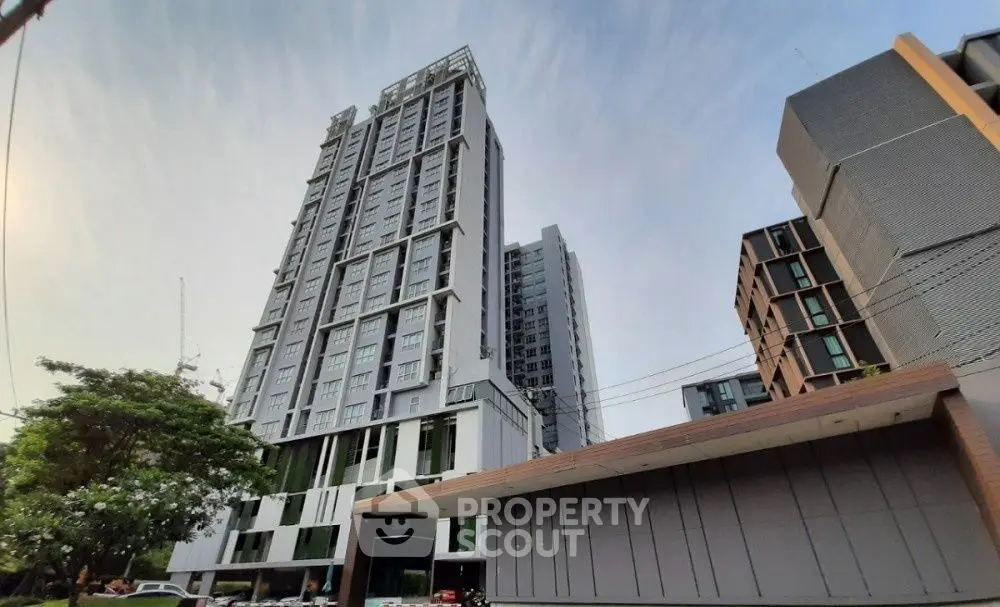 Modern high-rise residential building with sleek design and urban appeal.