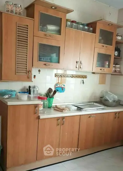 Charming kitchen with wooden cabinets and ample storage space