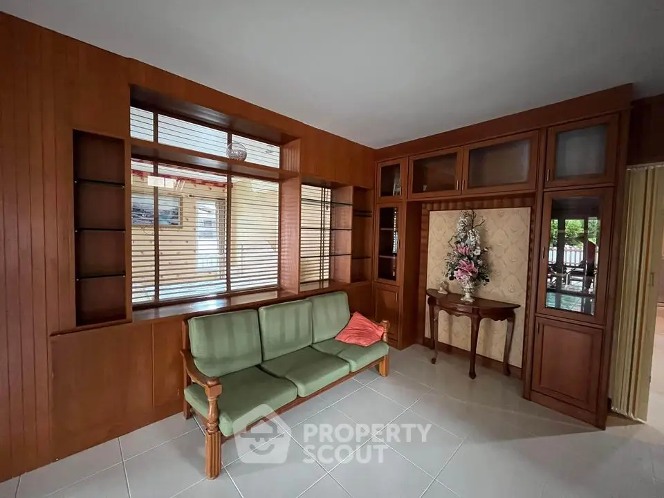 Charming living room with wooden paneling and vintage decor