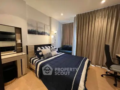 Modern bedroom with stylish decor and cozy ambiance, featuring a comfortable bed and elegant furnishings.