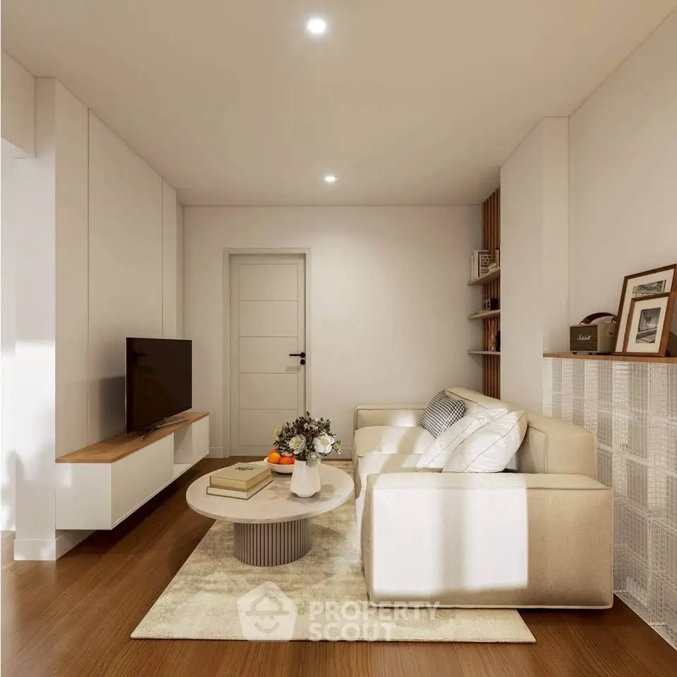 Modern living room with sleek furniture and warm lighting, perfect for cozy gatherings.