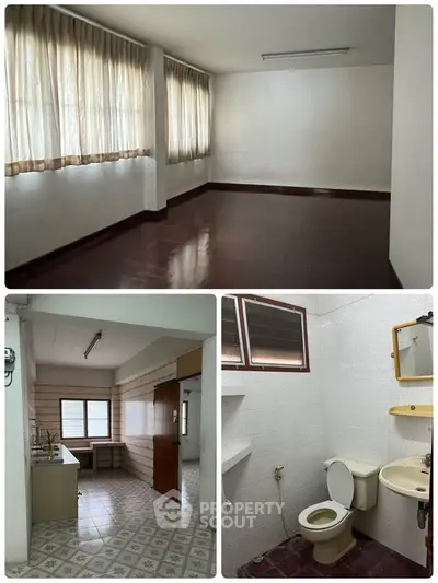 Spacious apartment with large windows, cozy kitchen, and clean bathroom, perfect for comfortable living.