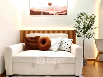 Cozy living room with stylish sofa and decorative pillows, perfect for modern interiors.