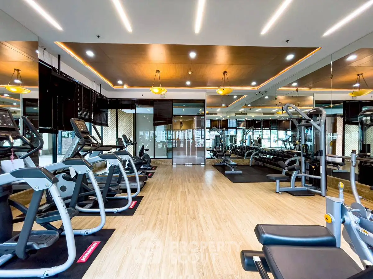 Modern gym with state-of-the-art fitness equipment and stylish interior design.