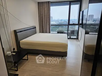 Spacious bedroom with stunning city view and modern furnishings