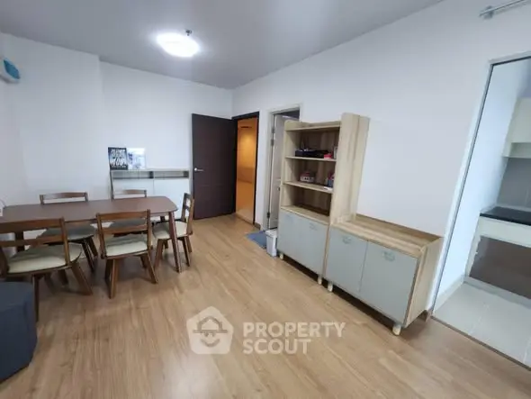 Spacious dining area with wooden flooring and modern furniture