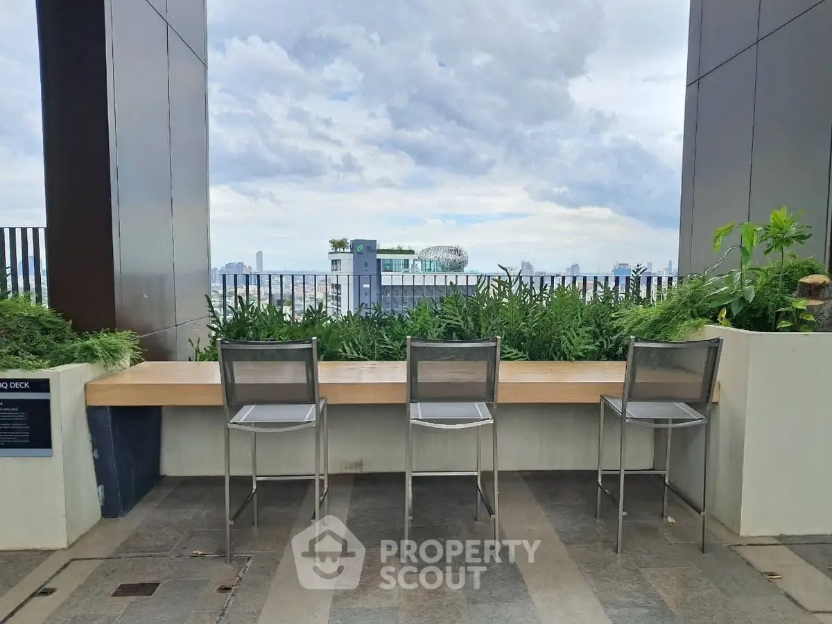Stunning rooftop view with modern seating and lush greenery