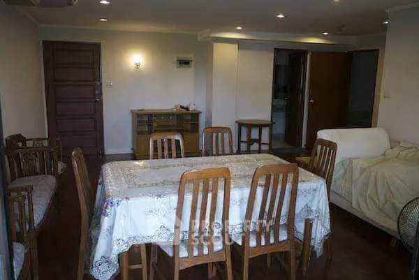 Spacious dining area with wooden furniture and cozy lighting