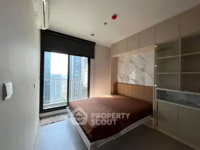 Modern bedroom with city view and built-in storage