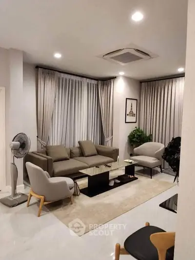Modern living room with stylish furniture and elegant decor