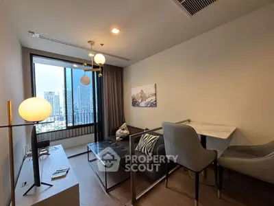 Modern living room with city view, stylish furniture, and elegant lighting in a high-rise apartment.