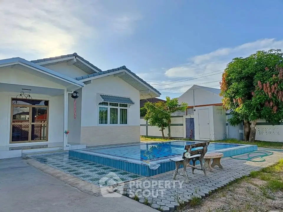 Charming single-story home with private pool and lush garden, perfect for relaxation and outdoor enjoyment.