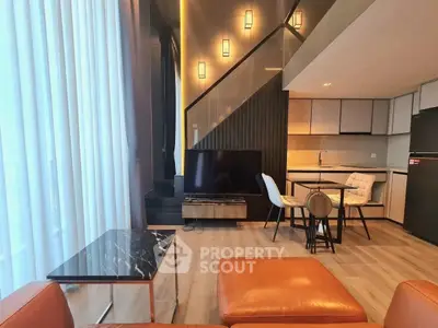 Modern living room with stylish decor and open kitchen layout