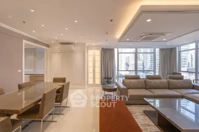 Luxurious modern living room with elegant dining area and city view.