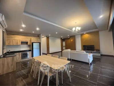 Spacious modern living room with open kitchen and elegant dining area