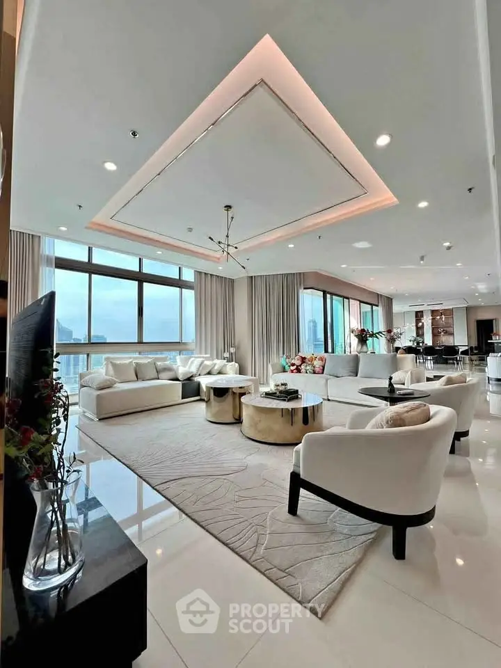 Luxurious modern living room with panoramic city views and elegant furnishings.