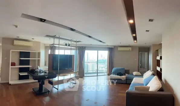 Spacious modern living room with city view and stylish furniture