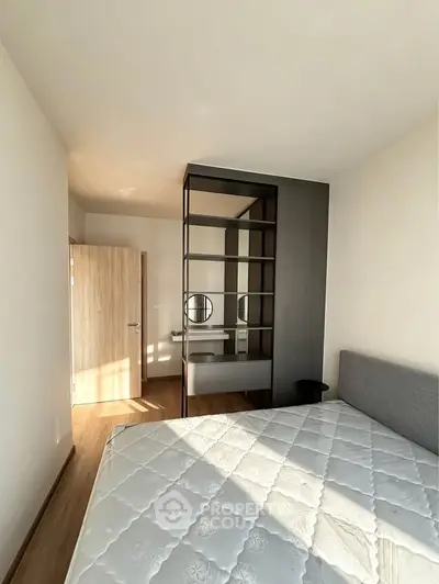 Modern bedroom with stylish partition and natural light