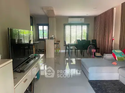 Spacious modern living room with sleek furniture and large windows for natural light