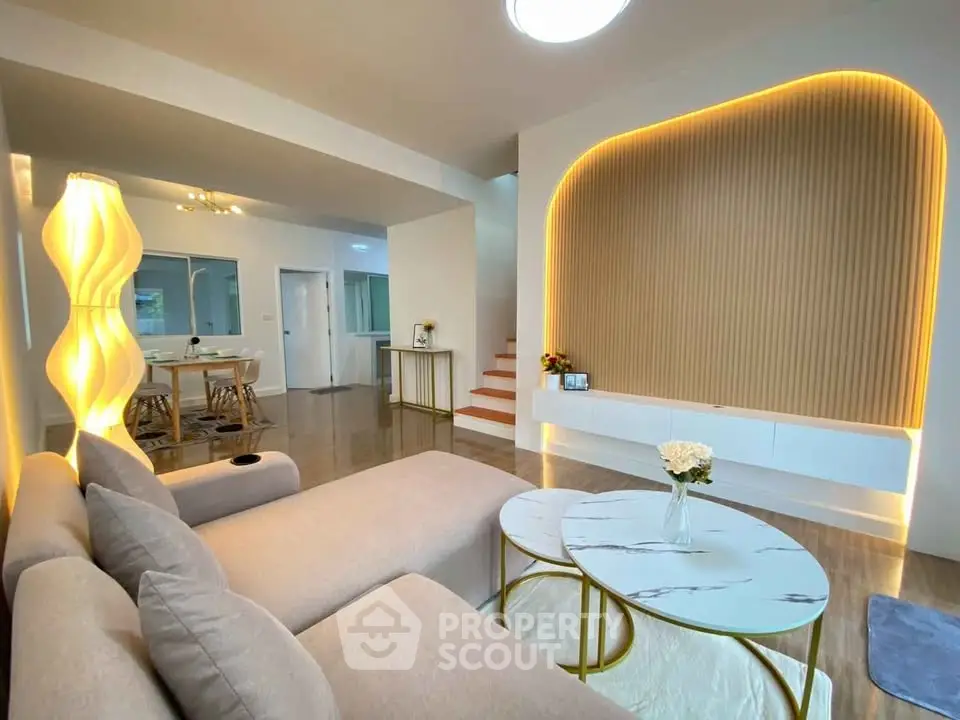 Modern living room with stylish lighting and elegant decor