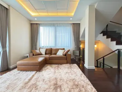 Luxurious living room with modern decor and plush carpet