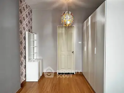 Spacious modern bedroom with elegant wallpaper and stylish wardrobe