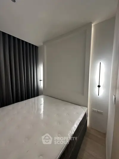 Modern minimalist bedroom with sleek lighting and elegant design