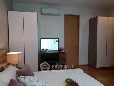 Cozy bedroom with modern decor and ample storage space