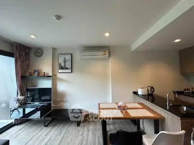 Modern living room with open kitchen and stylish decor