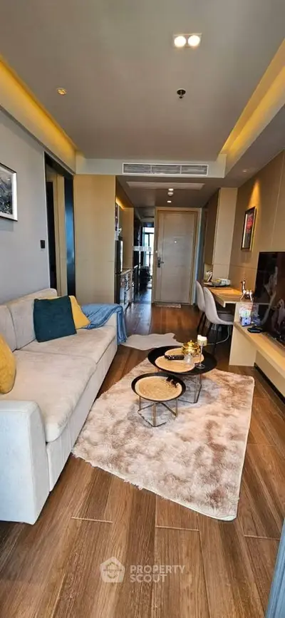 Modern living room with cozy decor and stylish furniture in a contemporary apartment.