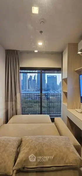 Modern living room with city view and cozy sofa, perfect for urban living.