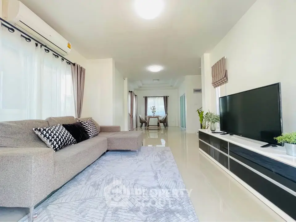 Spacious modern living room with sleek decor and natural light