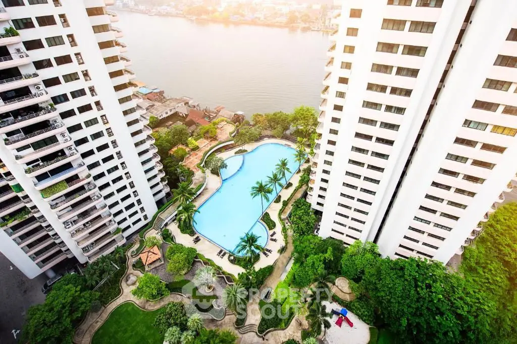 Luxurious high-rise apartments with stunning river view and poolside oasis.