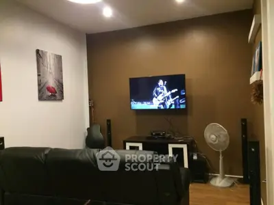 Cozy living room with modern decor and wall-mounted TV