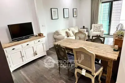 Charming living room with rustic dining set and cozy seating area, perfect for relaxation and entertaining.
