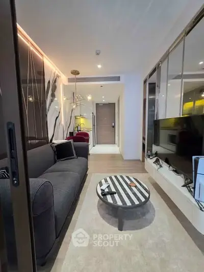 Modern living room with stylish decor and sleek furniture in a contemporary apartment.
