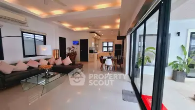 Spacious modern living room with open layout and large windows