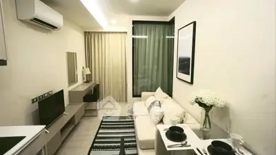Modern living room with sleek furniture and stylish decor in a cozy apartment setting.