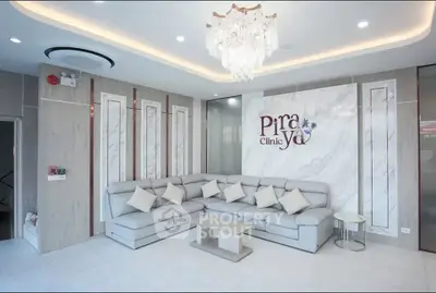 Luxurious clinic reception with elegant chandelier and modern decor