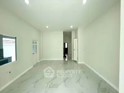 Spacious modern living room with marble flooring and bright lighting