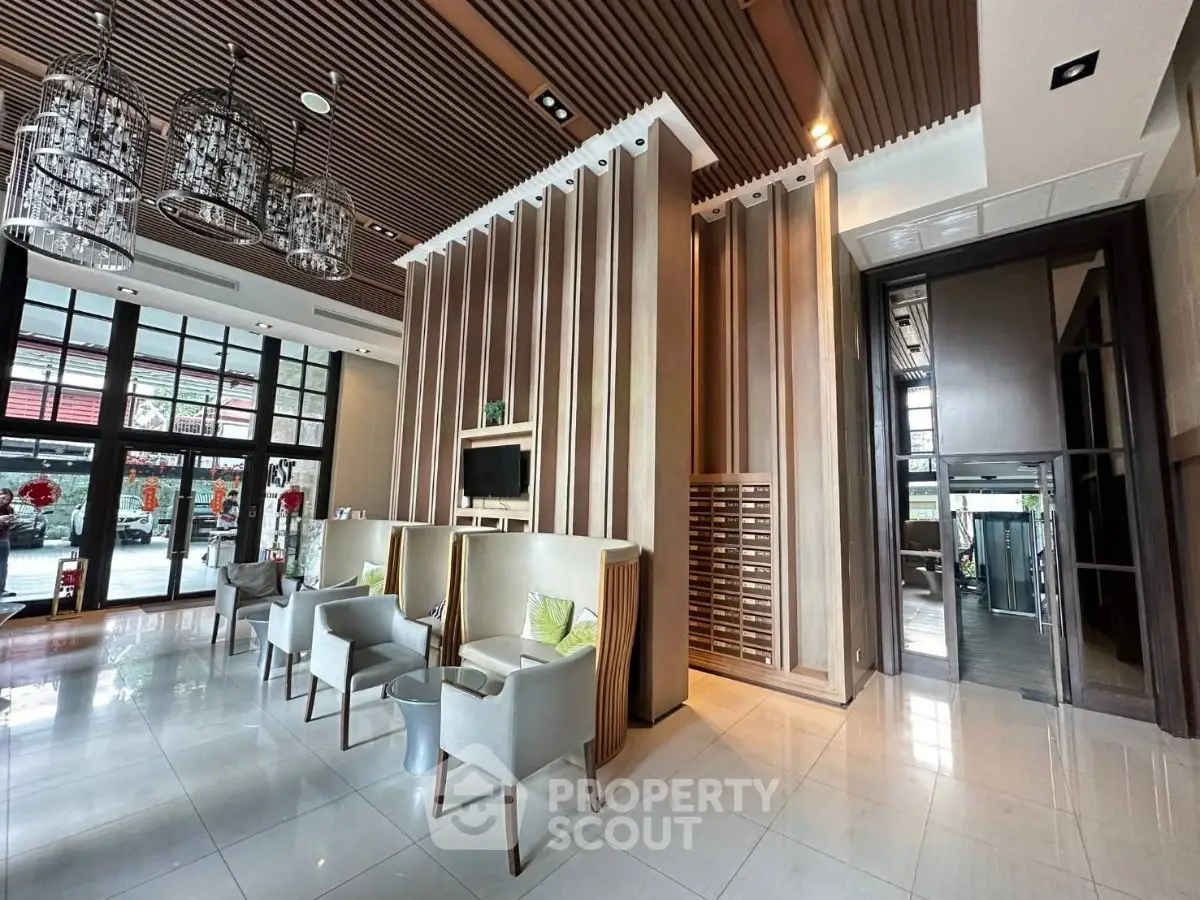 Luxurious modern lobby with elegant seating and stylish decor, perfect for welcoming guests in a high-end building.