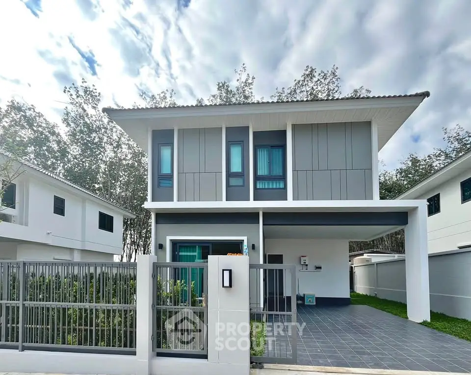 Modern two-story house with sleek design and spacious driveway