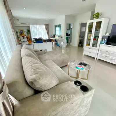 Spacious modern living room with plush sofa and elegant decor