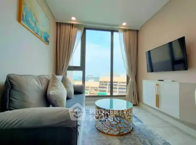 Modern living room with large window and stylish decor