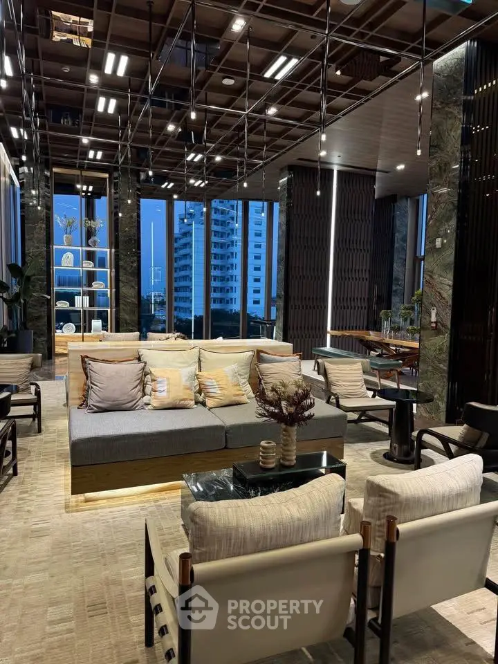 Luxurious modern living room with floor-to-ceiling windows and elegant decor.